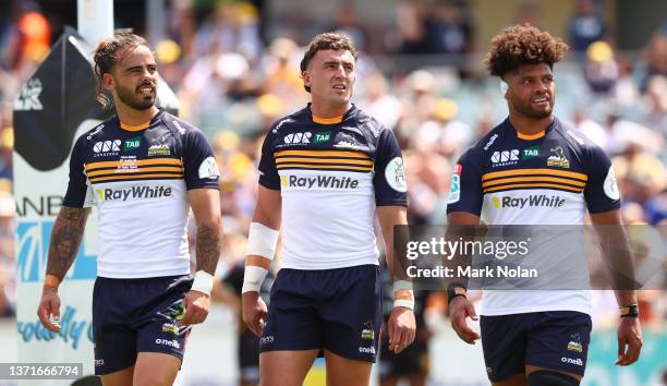 Andy Muirhead, Tom Banks and Robbie Valetini of the Brumbies are pictured during the round one Super Rugby Pacific match between the ACT Brumbies and...