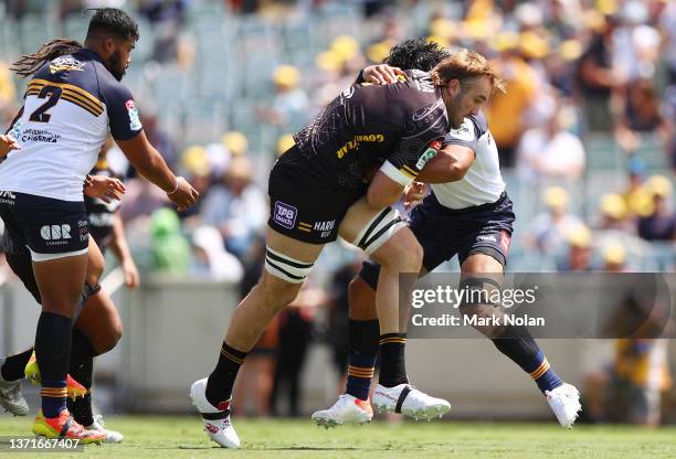 Izack Rodda of the Force is tackled during the round one Super Rugby Pacific match between the ACT Brumbies and the Western Force at GIO Stadium on...