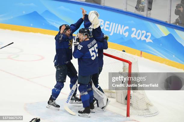 Harri Sateri of Team Finland celebrates with teammates after winning the Gold medal during the Men's Ice Hockey Gold Medal match between Team Finland...