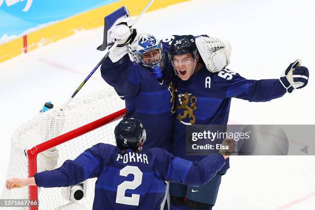 Harri Sateri of Team Finland celebrates with teammates after winning the Gold medal during the Men's Ice Hockey Gold Medal match between Team Finland...