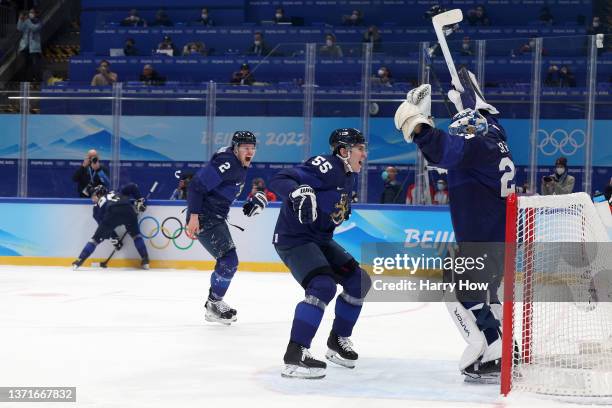 Harri Sateri of Team Finland celebrates with teammates after winning the Gold medal during the Men's Ice Hockey Gold Medal match between Team Finland...
