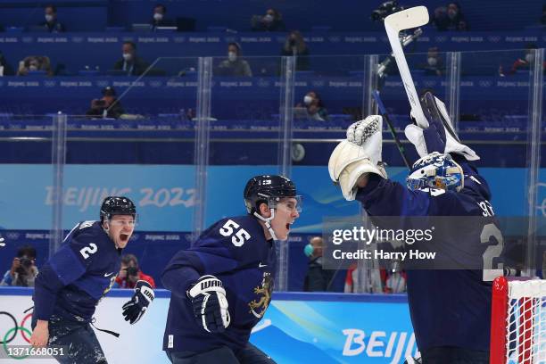 Harri Sateri of Team Finland celebrates with teammates after winning the Gold medal during the Men's Ice Hockey Gold Medal match between Team Finland...