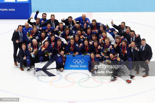 Members of Gold medallist Team Finland pose during the Men's Ice Hockey medal ceremony on Day 16 of the Beijing 2022 Winter Olympic Games at National...