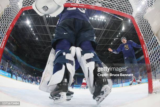 Harri Sateri of Team Finland and teammates celebrate after winning the Gold medal during the Men's Ice Hockey Gold Medal match between Team Finland...