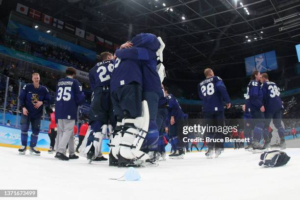 Harri Sateri of Team Finland and teammates celebrate after winning the Gold medal during the Men's Ice Hockey Gold Medal match between Team Finland...