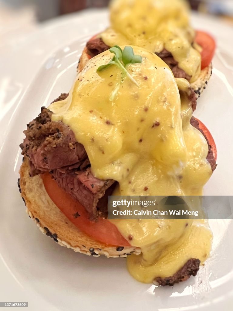 Beef pastrami, poached eggs, tomatoes & grain mustard on sesame bagel