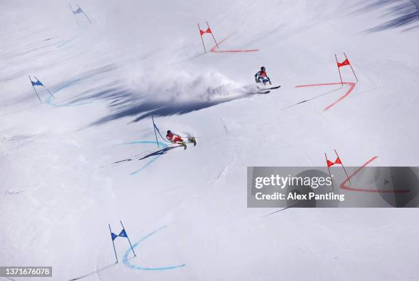 Steffan Brennstiener of Team Switzerland skis during the Mixed Team Parallel heats on day 16 of the Beijing 2022 Winter Olympic Games at National...