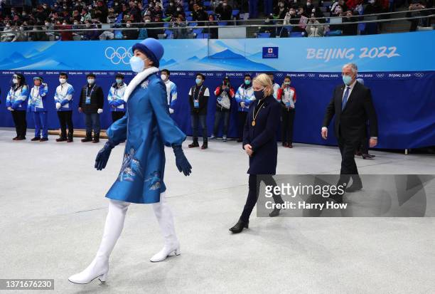 Medal Presenter Mrs. Emma Terho , Executive Board Member of the International Olympic Committee is accompanied by Mr. Luc Tardif , IIHF President ,...