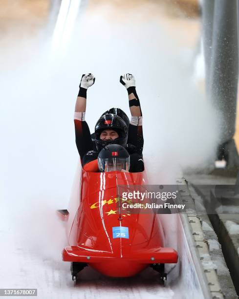Kaizhi Sun, Qingze Wu, Zhitao Wu and Heng Zhen of Team China react to their slide during the four-man Bobsleigh heat 4 on day 16 of Beijing 2022...