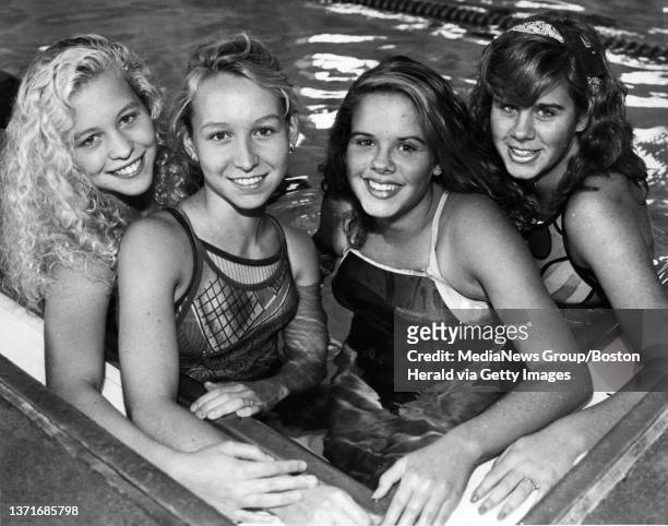 Britt and Kristen Greineder along with Kim and Ann Whitman in their Weston High swimming days. STAFF PHOTO BY ARTHUR POLLOCK