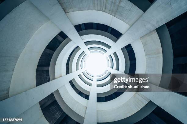 rotary lane in multi-storey parking lot - steady stock pictures, royalty-free photos & images