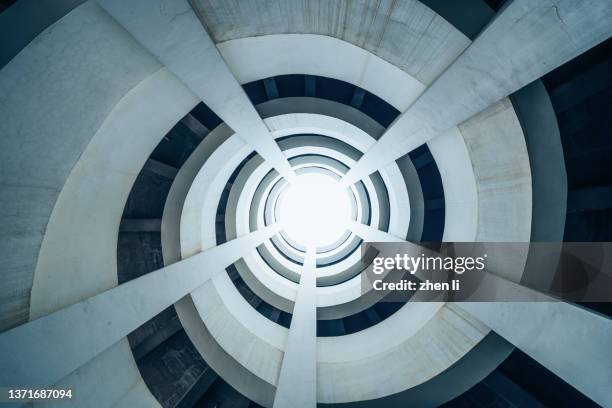 rotary lane in multi-storey parking lot - steady stock pictures, royalty-free photos & images