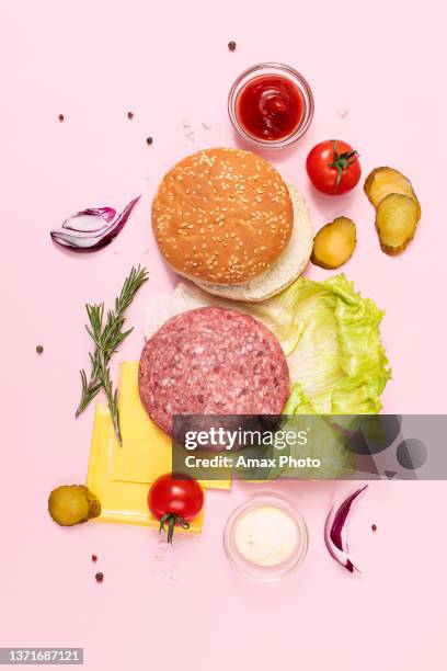ingredients of meat burger on pink background, flat lay, table top view - ingredient flatlay stock pictures, royalty-free photos & images
