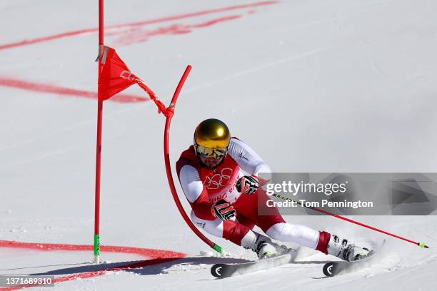 Johannes Strolz of Team Austria skis with one pole during the Mixed Team Parallel Big Final on day 16 of the Beijing 2022 Winter Olympic Games at...