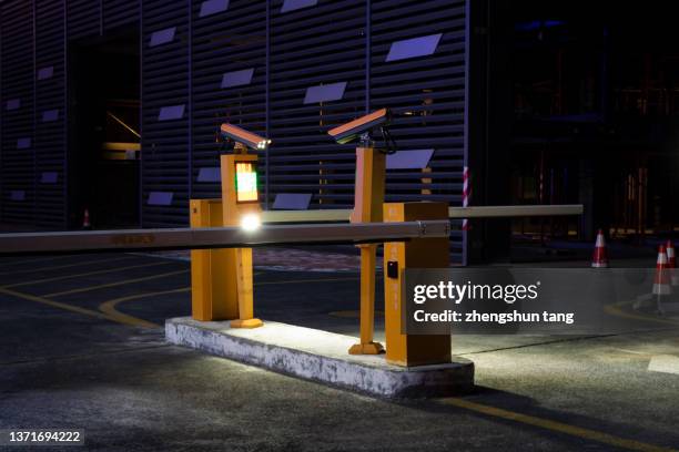 boom barriers in car park. - car park barrier stock pictures, royalty-free photos & images