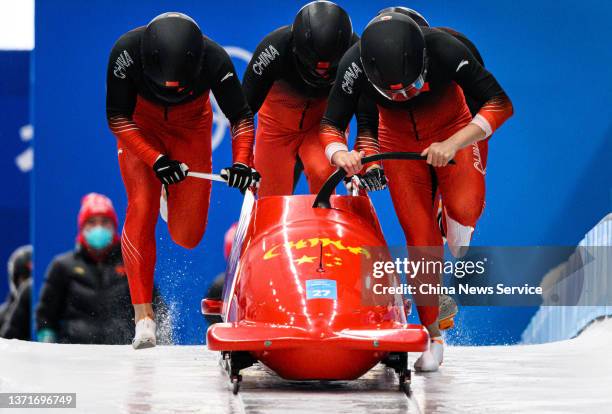 Li Chunjian, Ding Song, Ye Jielong and Shi Hao of Team China compete during the 4-man Bobsleigh Heat 3 on Day 16 of Beijing 2022 Winter Olympic Games...