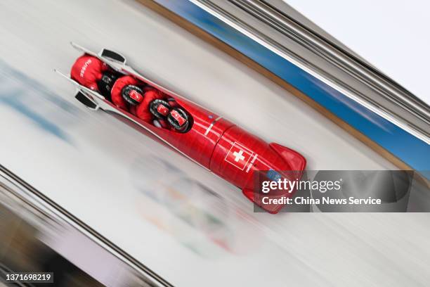 Simon Friedli, Adrian Fassler, Fabio Badraun and Andreas Haas of Team Switzerland compete during the 4-man Bobsleigh Heat 3 on Day 16 of Beijing 2022...