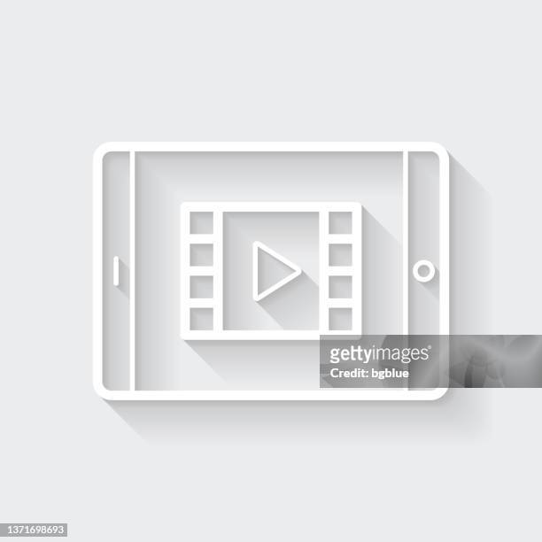watch video on tablet pc. icon with long shadow on blank background - flat design - netflix stock illustrations