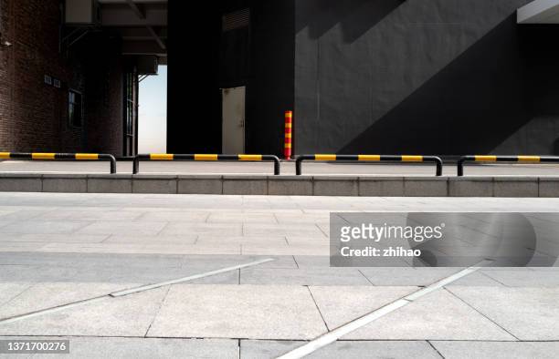 low angle view of open space with sun light effect - crash barrier stock pictures, royalty-free photos & images