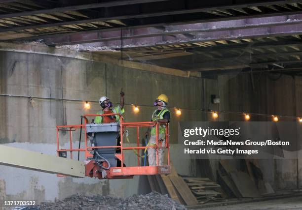 Workers repair a hole on a bridge near exit 33 on I-93 North that caused massive traffic delays, Wednesday, August 04 Medford, MA.