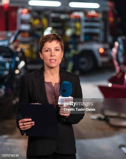 female reporter covering traffic disaster - reportage portrait stock pictures, royalty-free photos & images