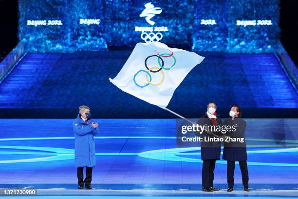 Guiseppe Sala, Mayor of Milano city and Gianpetro Ghedina, Mayor of Cortina d' Ampezzo City wave the Olympic flag as International Olympic Committee...