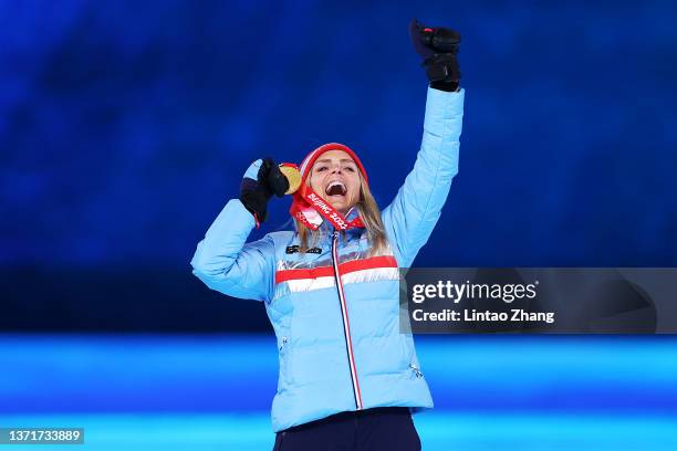 Gold medallist Therese Johaug of Team Norway poses with their medal during the Women's 30km Mass Start medal ceremony during the Beijing 2022 Winter...