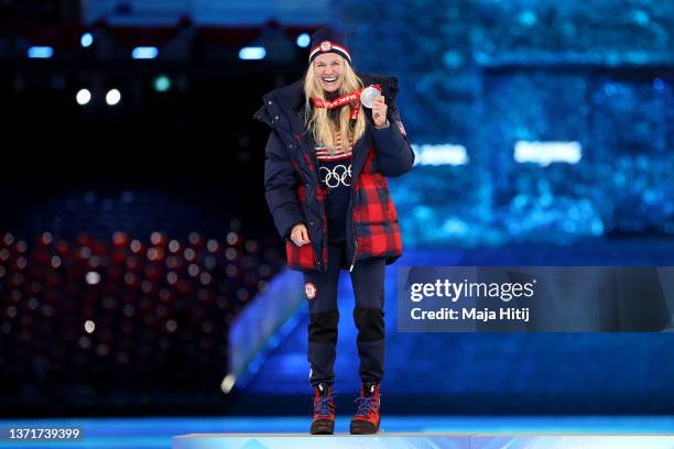 Silver medallist Jessie Diggins of Team United States celebrates with their medal during the Women's 30km Mass Start medal ceremony during the...