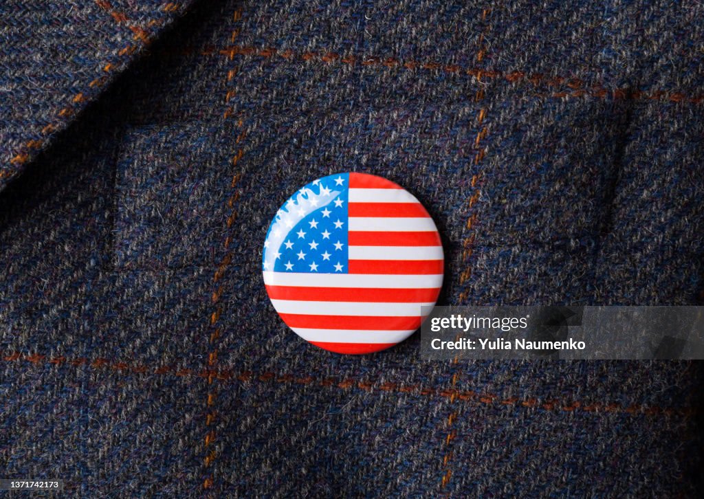 USA flag pin badge. Copy space.