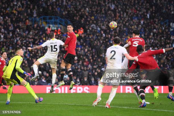 Harry Maguire of Manchester United scores their team's first goal during the Premier League match between Leeds United and Manchester United at...
