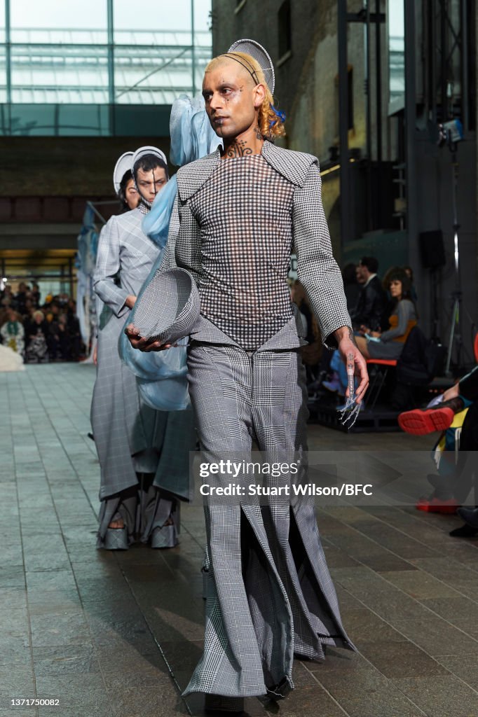 A model walks the runway during the Central Saint Martins MA Fashion ...