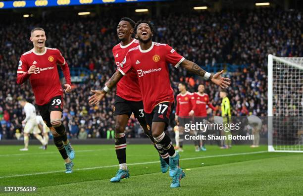 Fred celebrates with Anthony Elanga and Scott McTominay of Manchester United after scoring their team's third goal during the Premier League match...