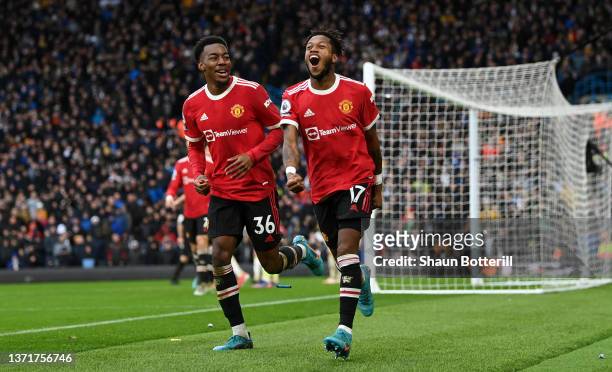 Fred celebrates with Anthony Elanga of Manchester United after scoring their team's third goal during the Premier League match between Leeds United...