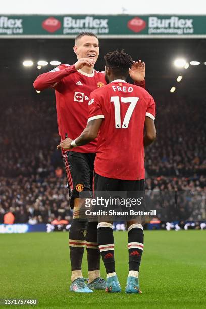 Fred of Manchester United celebrates with teammate Scott McTominay after scoring their side's third goal during the Premier League match between...