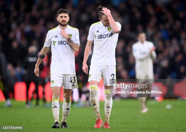Luke Ayling and Mateusz Klich of Leeds United look dejected following defeat in the Premier League match between Leeds United and Manchester United...