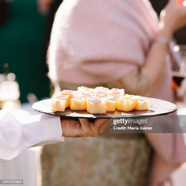 tray with canapes during the cocktail of a wedding outside during the day - almeria restaurant stock-fotos und bilder