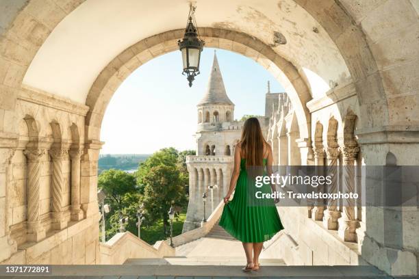 budapest fisherman's bastion hungary: young woman traveling europe - classical mythology character stock-fotos und bilder