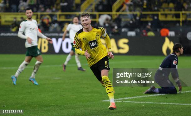 Marco Reus of Borussia Dortmund celebrates after scoring their team's fifth goal during the Bundesliga match between Borussia Dortmund and Borussia...