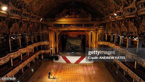 British maintenance engineer Darren Unsworth polishes the wooden floor during the annual cleaning of the ballroom in Blackpool Tower in Blackpool,...