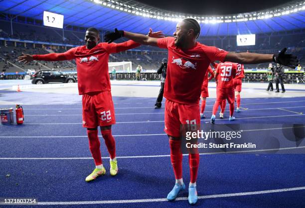 Christopher Nkunku of RB Leipzig celebrates with Nordi Mukiele of RB Leipzig after scoring their team's second goal from the penalty spot during the...