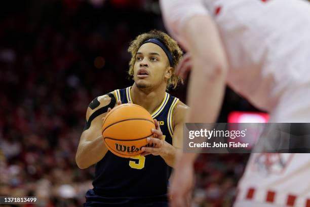 Terrance Williams II of the Michigan Wolverines shoots a free throw during the first half of the game against the Wisconsin Badgers at Kohl Center on...