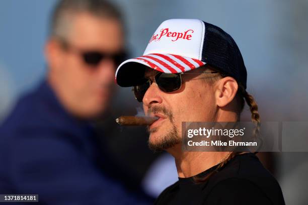 Recording artist Kid Rock looks on during the NASCAR Cup Series 64th Annual Daytona 500 at Daytona International Speedway on February 20, 2022 in...