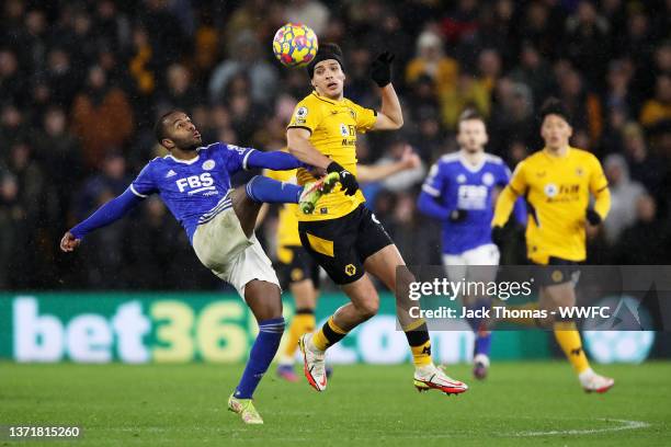 Raul Jimenez of Wolverhampton Wanderers battles for possession against Ricardo Pereira of Leicester City during the Premier League match between...