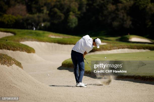 Joaquin Niemann of Chile plays a shot from a bunker on the seventh hole during the final round of The Genesis Invitational at Riviera Country Club on...