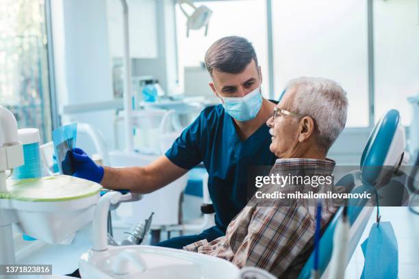 he has been his client for years - dentists office bildbanksfoton och bilder