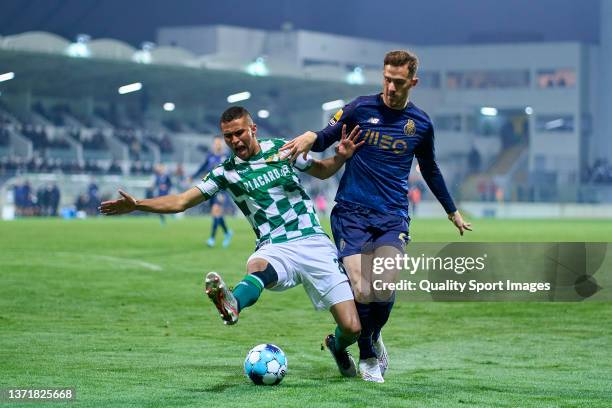 Toni Martinez of FC Porto competes for the ball with Pablo Santos of Moreirense FC during the Liga Portugal Bwin match between Moreirense FC and FC...