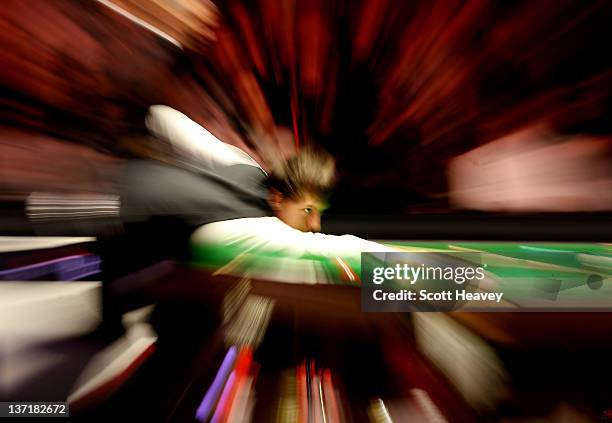 Judd Trump in action during his match against Stuart Bingham during day two of The Masters at Alexandra Palace on January 16, 2012 in London, England.