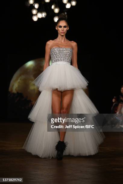 Model walks the runway at the AADNEVIK Show during London Fashion Week February 2022 on February 20, 2022 in London, England.