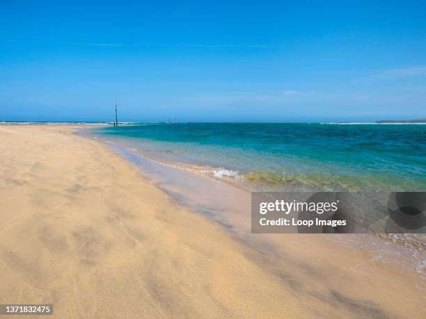 Blue sky and golden sands at Porthkidney Beach.