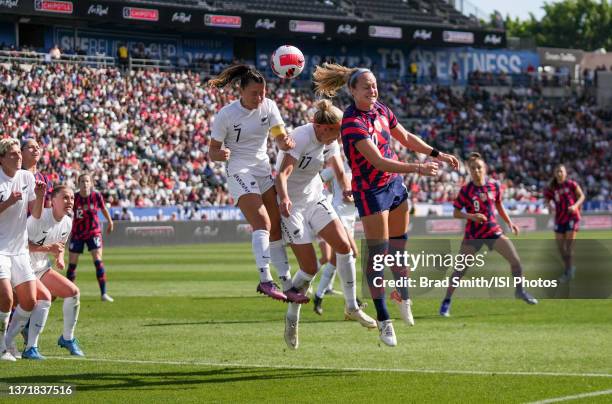 Jaelin Howell of the United States heads a ball past Ali Riley and Hannah Wilkinson of New Zealand during a game between New Zealand and USWNT at...